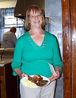 Louise Spicer, ALA member, serving breakfast.