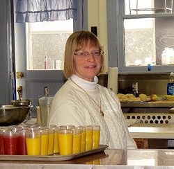 Louise Spicer helps out during the Sunday Community Breakfast.