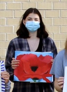 Sara Johnson, HS, and her award winning poppy oil painting.