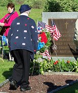 ALA President, Sylvia Witchella placing a wreath at St. Joseph's Cemetery.