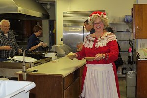 Volunteer Mrs. Claus getting her lunch.